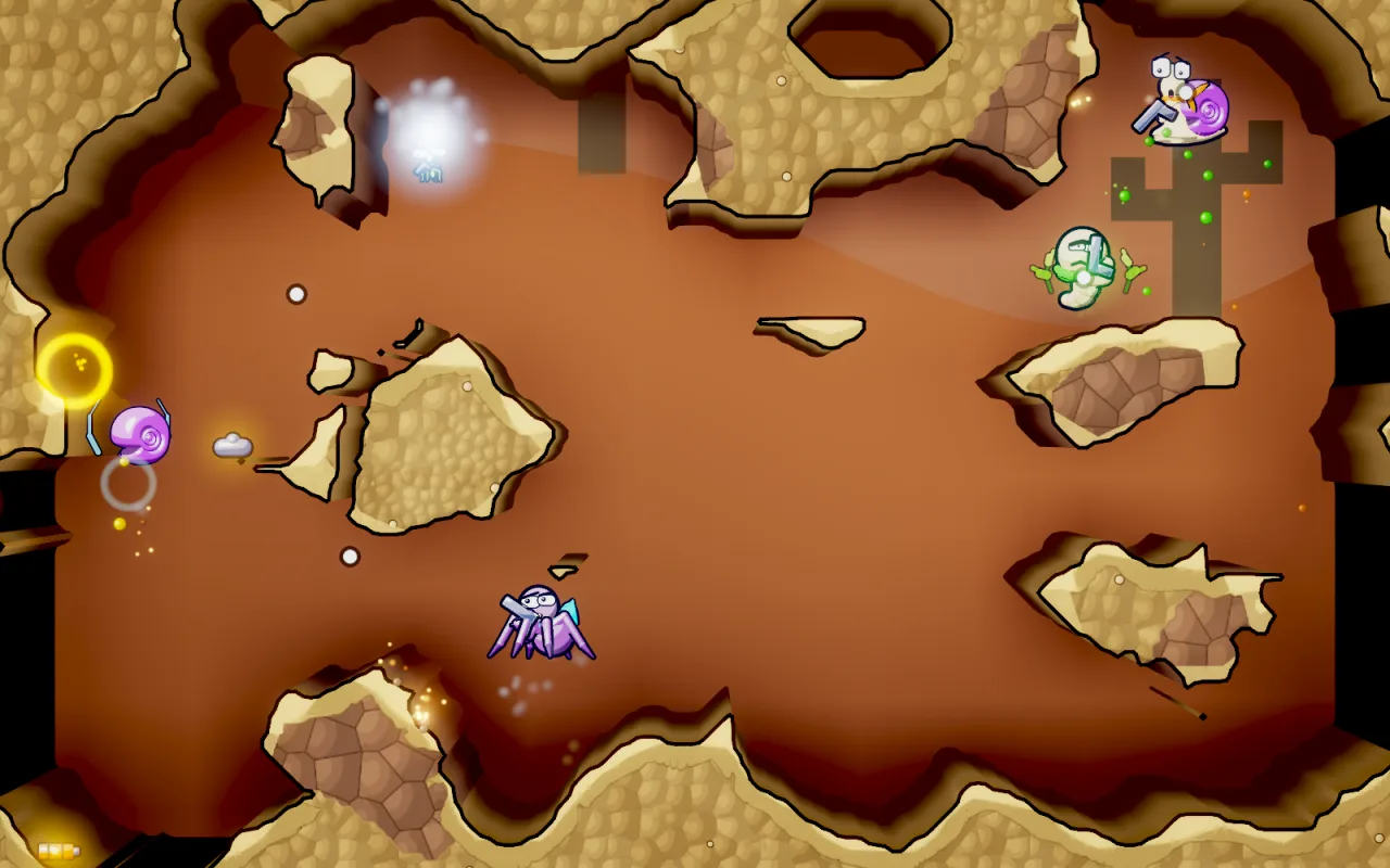 The same cave in the desert look, sandy dirt under a dusky sky with cacti.